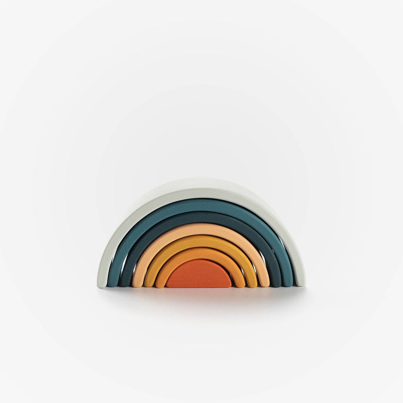 Decorative shelf with rainbow pattern on a white background