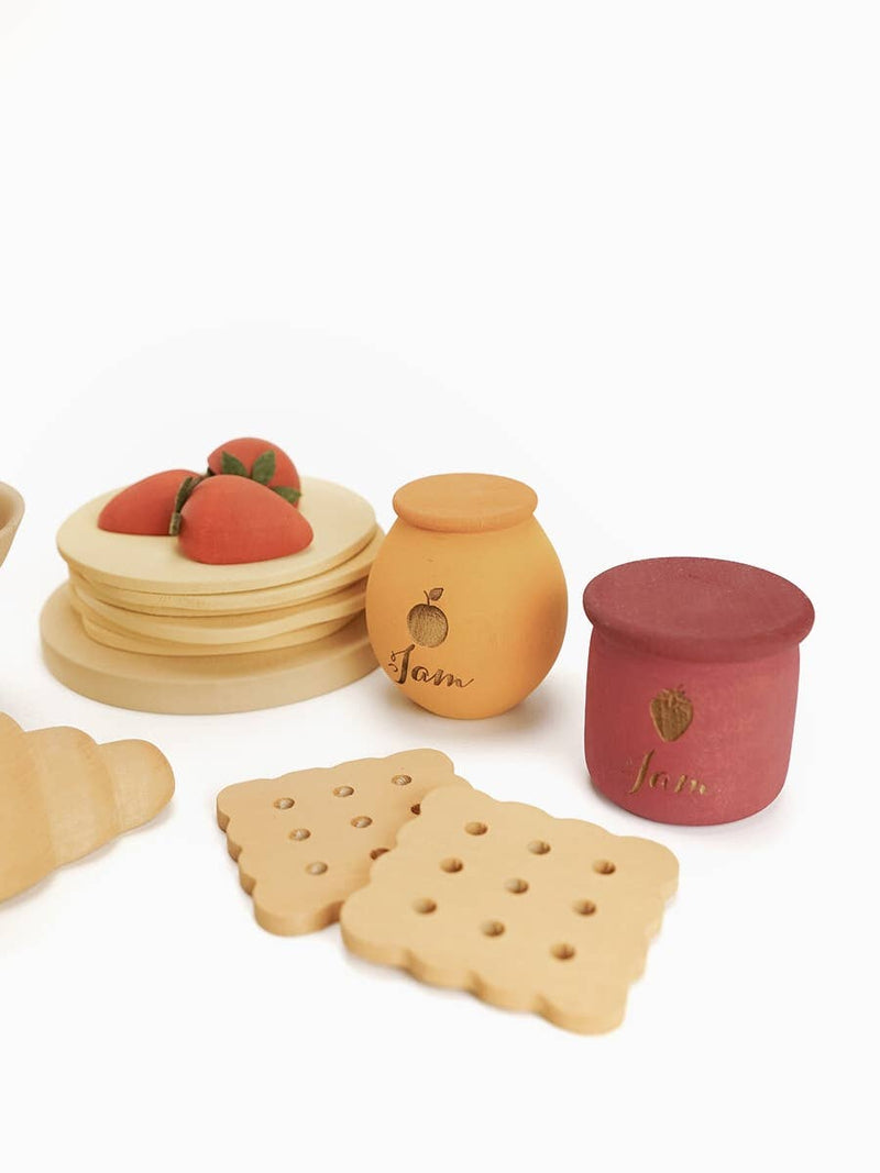 Set of wooden toys resembling food items on a white background