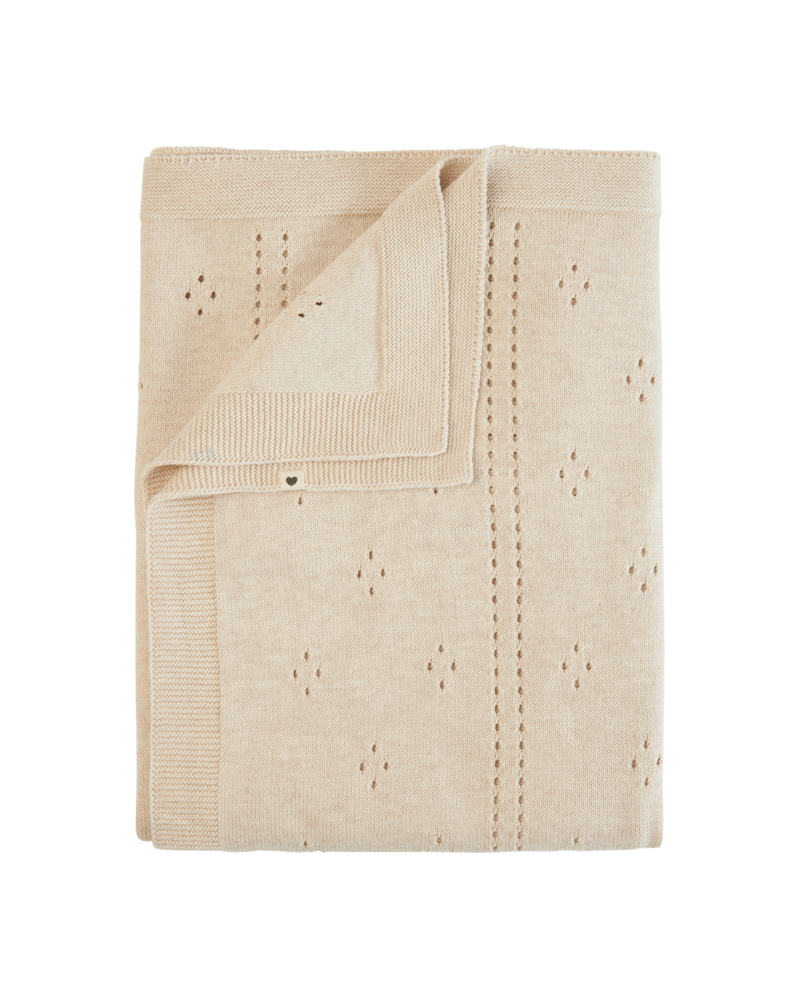 Beige knitted blanket with a subtle pattern on a white background
