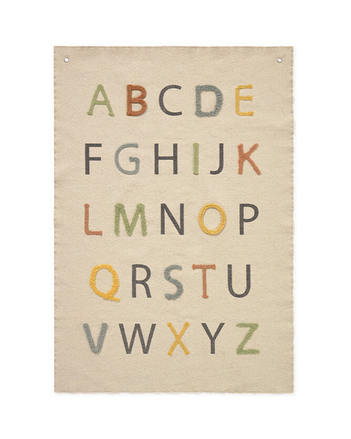 Beige wall art with embroidered alphabet letters on a white background