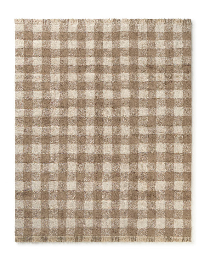 Checkered rug with brown and beige pattern on a white background