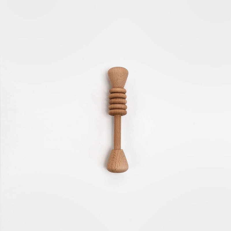 Wooden baby rattle on a white background